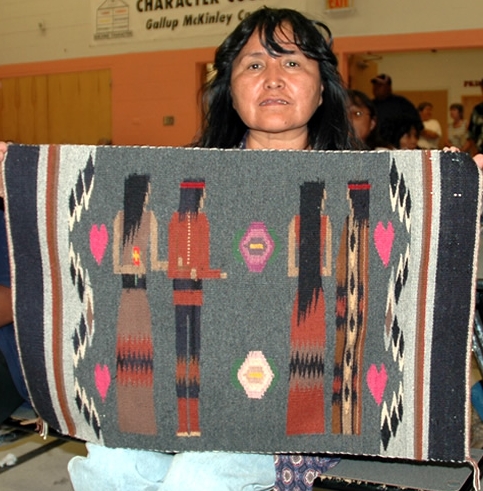 Navajo rug and weaver